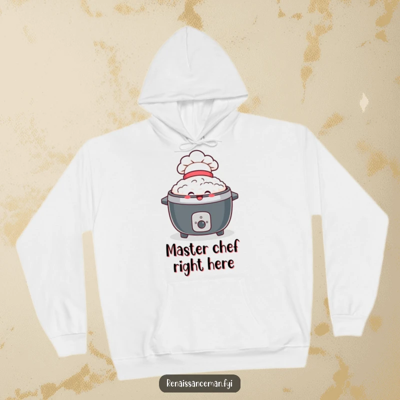 Funny hoodie featuring a delighted rice cooker wearing a tiny chef hat, offering warmth and a beaming smile.