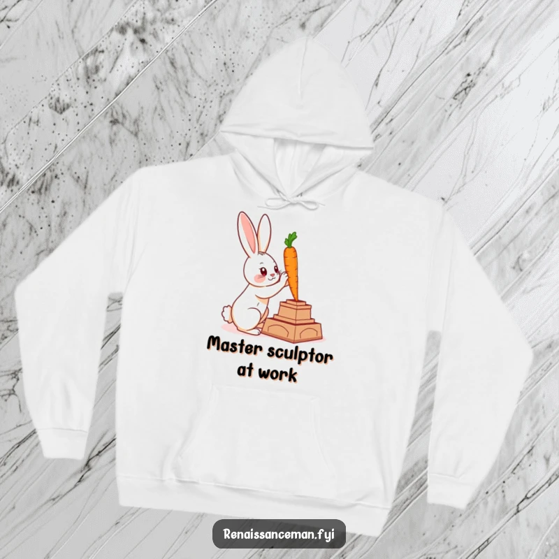 Funny hoodie featuring a clever rabbit sculpting a majestic statue from a carrot, ideal for cozy artistic expression.
