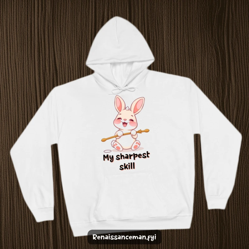 Funny hoodie featuring a cheerful bunny character beaming with glee while threading a large needle.