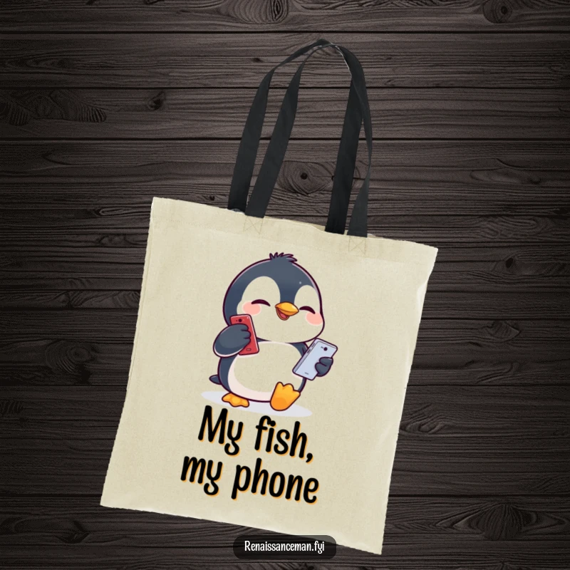 Funny penguin pulling a comical face while holding a mobile phone, ready to carry your items in this humorous tote bag.